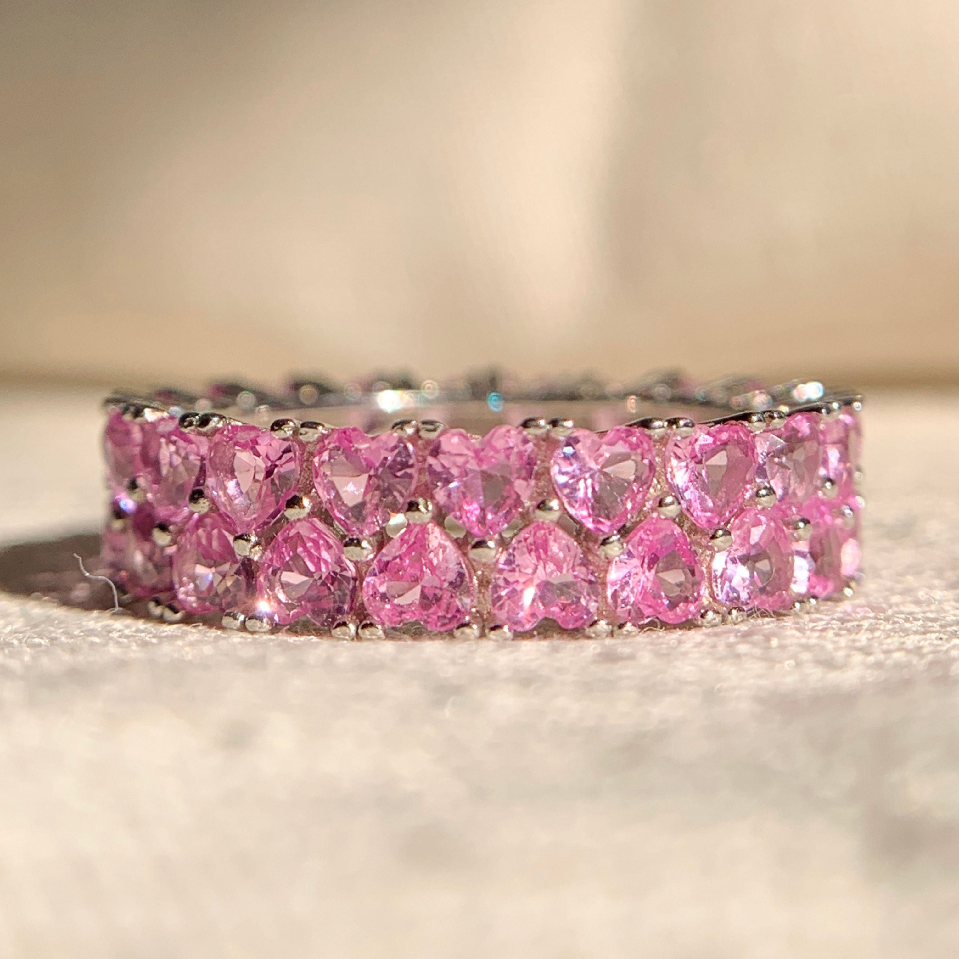 Elegant pink heart shaped diamond band in rose gold setting